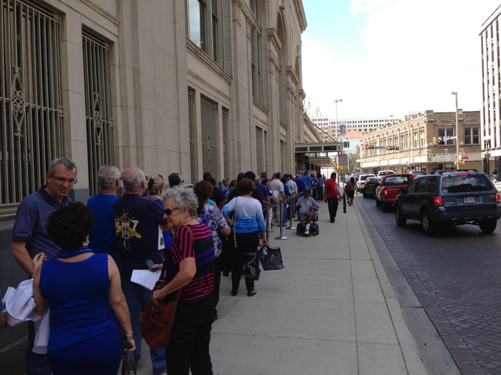 Opponents of the ordinance (wearing blue) waiting to get into City Hall.