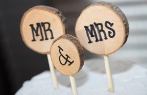 Cake toppers reading "mr. & Mrs."